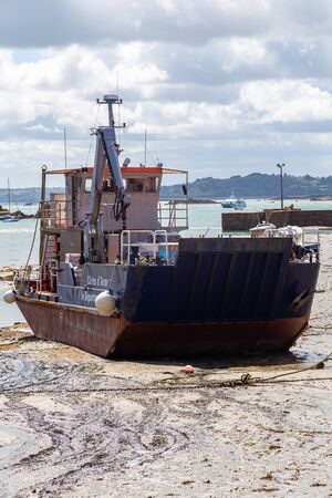 ILE DE BREHAT,FRANCE - AUGUST 13, 1214: Some boats lying on the sand during low tide. In Brittany (France) the tide can reach several meters.のeditorial素材