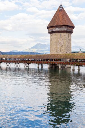 LUCERNE, SWITZERLAND - AUGUST 22, 2014: Famous Chapel Bridge in the historic city center of Lucerne, the citys symbol and one of Switzerlands main tourist attractions.のeditorial素材