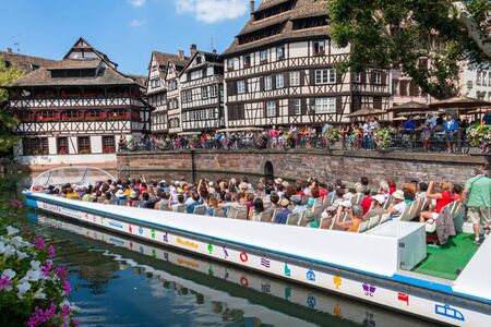 Strasbourg, France - August 10,2012: Petite France and canal, unesco world heritage site. With the boat you can take a tour of the canals of the historic centerのeditorial素材