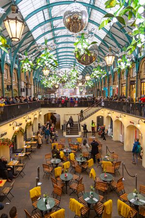 LONDON, UK - December 31, 2019: Covent Garden is one of the major tourist attraction places in London. Shops, pubs, restaurants and street artists make this area a must on any visit to Londonのeditorial素材
