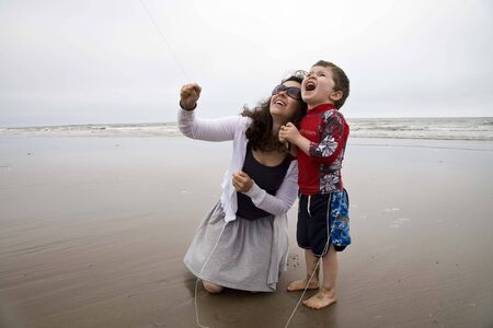 Canada, 04 July 2012_ A mother and her son fly a kite on Lawrencetown Beach near Dartmouth, Nova Scotia.のeditorial素材