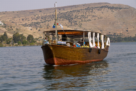 Tiberius,Israel, 03 May 2014- A tour boat is seen on the Sea of Galliee near Tiberius. The boat is an oversized replica of a fishing boat from the time of Jesusのeditorial素材