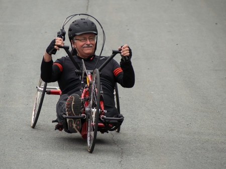 Dartmouth/NovaScotia/10June2016- Amputee Joe Robichaud, 65, enjoys riding a handcycle near his home.
