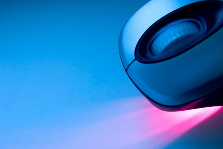  Wireless mouse with red laser in a tech backgroundの写真素材