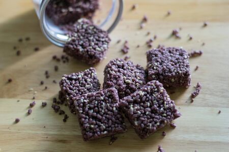 Crispy Riceberry Snack with white sesame seed on wooden.の写真素材
