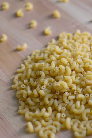 Macaroni on woodenの写真素材