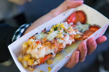 lobster from street food at Myeong-Dong night market, South Korea topped with melted cheese, corn and spring onions. Looks deliciousの写真素材