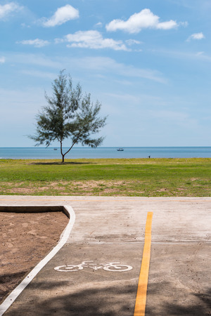 bike lane near the beach with sea view and beautiful blue skyの写真素材