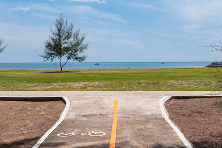 bike lane near the beach with sea view and beautiful blue skyの写真素材