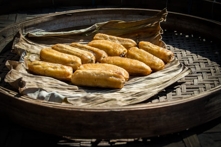 Dried banana in bamboo tray.