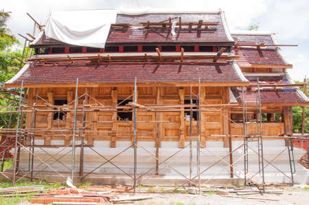 struction of new monk's house in countryside of thailand made of wooden and mortarの写真素材