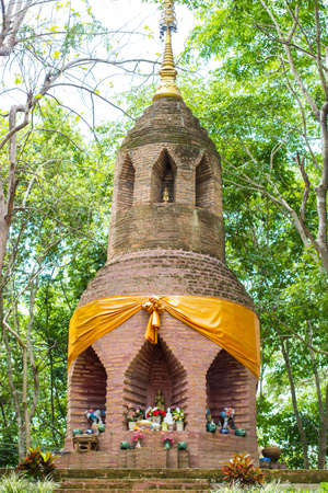bricked pagoda of buddhism in natural forest in countryside of thailandの写真素材