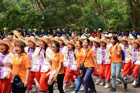 Chiang Mai, Thailand - September 12, 2015: student from Faculty of Nursing in Chiang Mai university CMU  walk and sing their song for show spirit in Freshmen Welcoming Ceremony of CMU at Doi suthep temple on September 12, 2015 in Chiang Mai, Thailand.のeditorial素材