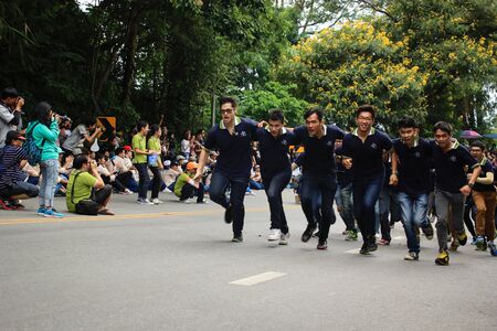 Chiang Mai, Thailand - September 12, 2015: student from Chiang Mai university CMU  run on hill to go to temple for show spirit in Freshmen Welcoming Ceremony of CMU at Doi suthep temple on September 12, 2015 in Chiang Mai, Thailand.のeditorial素材