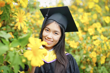 graduate from Faculty of Science at Mexican Sunflower field, Thailandの写真素材