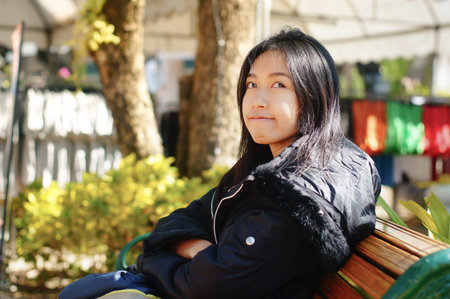 girl missing someone on winter at park