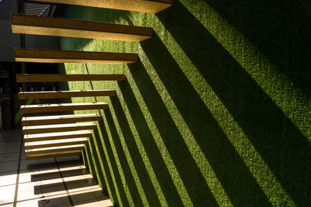 modern wooden stair on green backgroundの写真素材