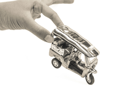 Tuk Tuk -  Thailand taxi model, mini toy on isolated white backgroundの写真素材