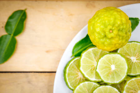 Top view of sliced bergamot on wood background with copy spaceの写真素材