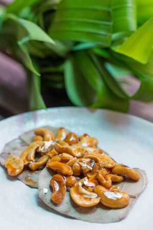 Cashew nut with sticky honey on the leafの写真素材