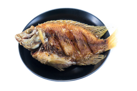 tilapia Fish fried in the dish, Fish fried isolatedの写真素材