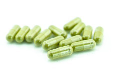 Moringa capsule pills on white の写真素材