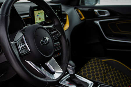 MOSCOW, RUSSIA - JANUARY 10, 2021 KIA XCeed. AWD Hatchback SUV. New KIA XCeed crossover model year 2020. KIA company badge close up view on the steering wheel close up view.のeditorial素材