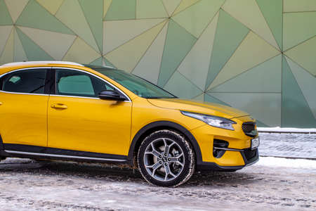 MOSCOW, RUSSIA - JANUARY 10, 2021 KIA XCeed. AWD Hatchback SUV. New KIA XCeed crossover model year 2020.Yellow KIA on winter background. Compact SUV car produced by Kia Motors. Front side close up viewのeditorial素材