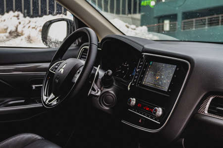 MOSCOW, RUSSIA - JANUARY 30, 2021 Mitsubishi Outlander dark interior close up view. Third generation of Japanese compact SUV. Mitsubishi Outlander model year 2020. Dashboard and steering wheel view.のeditorial素材