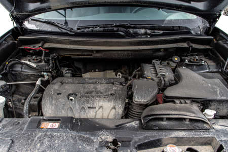 MOSCOW, RUSSIA - JANUARY 30, 2021 Mitsubishi Outlander close up engine view with opened car bonnet. Third generation of Japanese compact SUV. Mitsubishi Outlander model year 2020.のeditorial素材