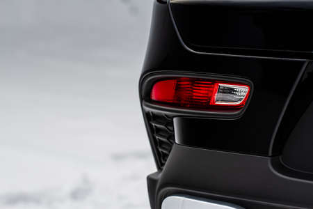 Close up back light of the modern black car. Rear car stop lights on car bumper.の写真素材