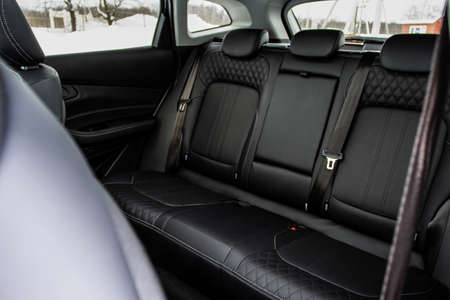 Modern SUV car inside. Leather black back passenger seats in modern luxury car. Comfortable leather seats.の写真素材
