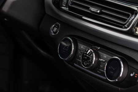 Digital control panel car air conditioner dashboard. Modern car interior conditioning buttons inside...
