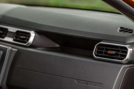 MOSCOW, RUSSIA - MAY 08, 2021 Renault Duster second generation details view. Interior car air conditioning close up view on the car plastic dashboard.のeditorial素材