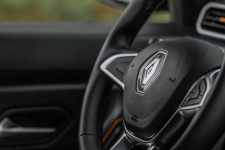 MOSCOW, RUSSIA - MAY 08, 2021 Renault company logo close-up view on the steering wheel. Logo of the...