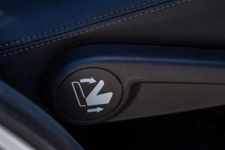 Folding second row seat button. 12V power socket in a car. Outlet socket in a car.の写真素材