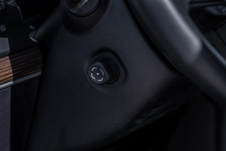Adjustable steering wheel in modern car. Tilt and telescopic steering control lever. Steering wheel...