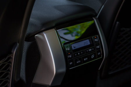Digital control panel car air conditioner dashboard. Modern car interior conditioning buttons inside...