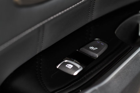 Seat heating controller buttons close up view. Car interior. Seat heater button, car interior.