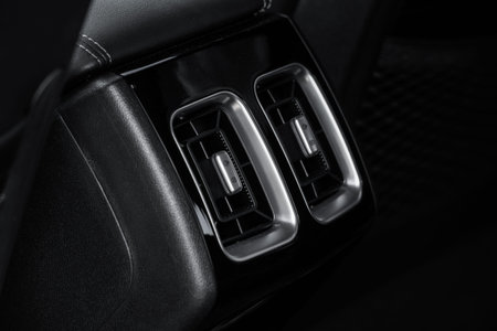 Car air conditioning buttons close up view inside a car. Car temperature conditioner dashboard...
