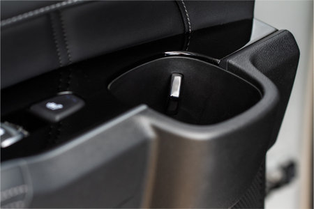 Cup holders inside modern car interior. Interior view of modern car.