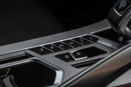 Close up view of modern car electronic safety systems control panel. Modern car interior detail.