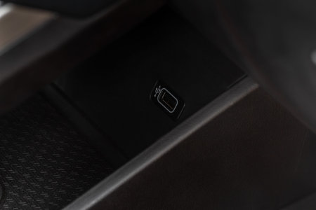 USB port in the car panel close up. Car interior detail. Car usb charger detail.の写真素材
