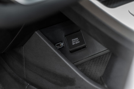 Opened car USB port in the car for connecting device. Power output of usb charger close up view. Car...
