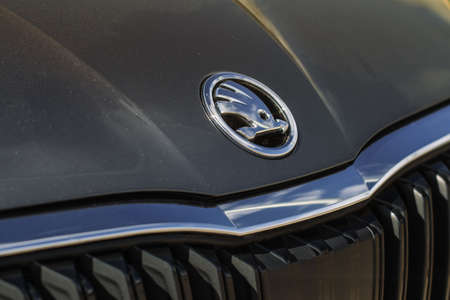 MOSCOW, RUSSIA - APRIL 04, 2021 Skoda company logo close-up view on the car hood. Logo of the Czech manufacturer Skoda Auto.のeditorial素材