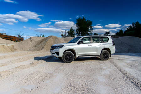MOSCOW, RUSSIA - JUNE 02, 2021 Toyota Land Cruiser Prado model year 2021. SUV model year 2021 on nature background. Toyota Land Cruiser Prado in motion on the sand.のeditorial素材