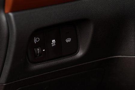 Close up view of modern car electronic safety systems control panel. Modern car interior detail.
