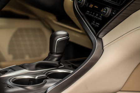 Modern automatic gearbox. Close up of the gearbox transmission handle. Automatic gear stick.