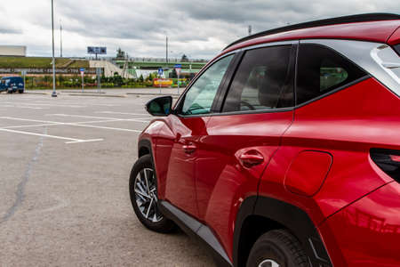 MOSCOW, RUSSIA - SEPTEMBER 9, 2021 New Hyundai Tucson Fourth generation (NX4), a compact crossover SUV car model year 2021 on city background. Exterior front side close up view.のeditorial素材