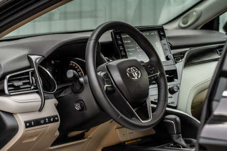 MOSCOW, RUSSIA - AUGUST 15, 2021 Toyota Camry (XV70), a mid-size sedan car model year 2021 on city background. Interior close up view. Interior details of Toyota Camry.のeditorial素材